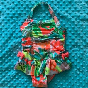 Size 2T adorable swimsuit with easy snaps!